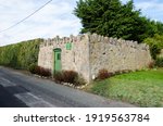 Small photo of Caerwys, Flintshire; UK: Feb 11, 2021: The square, stone built shelter in Caerwys is a pinfold which would have been used in the past to house stray farm animals until they could be returned.
