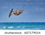 Small photo of kiteboarder athlete performing kiteboarding kitesurfing tricks unhooked