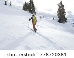 A group of young men ski touring in the mountains near Terrace, British Columbia, Canada.