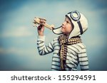 Little Boy With Wooden Plane