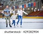 Family with child at ice-skating rink
