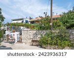 Small photo of AGIOS NIKITAS, LEFKADA, GREECE - AUGUST 25, 2023: Summer view of village of Agios Nikitas at Lefkada, Ionian Islands, Greece