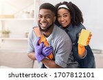 Loving Black Couple Cleaning...