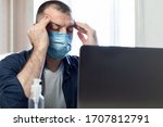 Small photo of Coronavirus And Coronacrisis. Stressed Man At Laptop Massaging Temples Having Business Problems Sitting At Home. Selective Focus