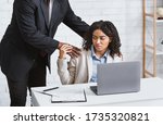 Small photo of Workplace harassment concept. Disgusted female secretary stopping her boss from molesting her at company office. Panorama