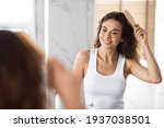Cheerful Female Combing And...
