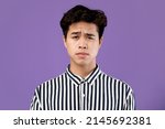Lack of Energy Concept. Portriat Of Tired Young Sleepy Man Looking At Camera, Exhausted Guy Can't Keep His Eyes Open, Sluggish Male Wants To Nap, Standing Isolated On Purple Violet Studio Background