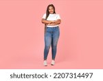 Full Length Shot Of Attractive Black Plus Size Woman Model Standing Over Pink Background. Happy Overweight Lady Posing In Studio. Female Beauty Concept