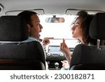 Small photo of Quarrel In Car. Angry Middle Eastern Couple Having Conflict Expressing Disagree And Argument Sitting In Automobile Inside During Traffic Jam. Relationship Problems Concept. Rear View Shot