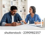 Small photo of Support Concept. Young Doctor Woman Comforting Upset Indian Male Patient In Clinic, Therapist Lady Soothing Mature Man After Sharing Bad News, Touching His Hand, Expressing Empathy, Closeup