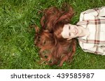 Teenage Girl Laying In Grass