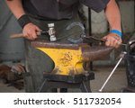 Small photo of Feilding, New Zealand - Nov 5th 2016: Man making horseshoes at the IAP Show.