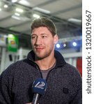 Small photo of ODESSA, UKRAINE - February 16, 2019: Interview of captain of Ukrainian national basketball team Vyacheslav Kravtsov during opening of children's championship. Basketball player Vyacheslav Kravtsov