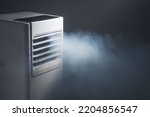 Small photo of louvers outlet of portable air conditioner with cold steam, close-up view