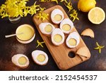 Linzer cookies in a shape of Easter eggs filled with lemon curd
