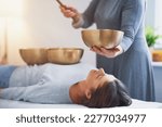 Small photo of Woman having a Tibetan sound bowl massage