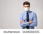 Small photo of is time to protect all the time. elegant man wearing a mouth protection to prevent getting sick at work or on the way to work