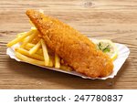 Fried Fish And Chips On A Paper ...