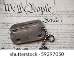 Freedom is not free . Dog tag on American Constitution