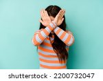 Small photo of Young caucasian woman isolated on blue background keeping two arms crossed, denial concept.