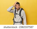 Young Hispanic man ready for hiking being shocked, she has remembered important meeting.
