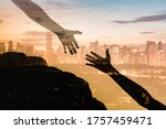 Silhouette of giving a helping hand, hope and support each other over sunset city background. Double exposure 