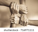 Hands united helping each other....