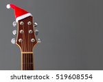 Red Christmas Hat On Guitar...