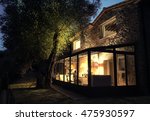 Small photo of Stunning house with sun porch at night