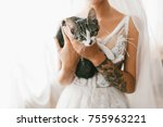 Young Bride Holding A Cat....