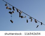 Shoes Hanging On A Cable
