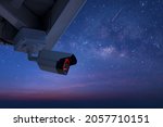 Small photo of Online Security CCTV camera surveillance system outdoor of house. A blurred night city scape background. Real time Modern CCTV camera on a pole. Equipment system service for safety life or asset.
