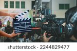 Small photo of Man hands holding movie clapper.Film director concept.camera show viewfinder image catch motion in interview or broadcast wedding ceremony, catch feeling, stopped motion in best memorial day concept.