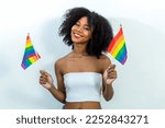 Young woman holding LGBT rainbow flag. Woman holds a flag of the LGBT community .
