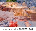 Small photo of Landscape like a planet Mars surface. Ural refractory clay quarries. Nature of Ural mountains, Russia. The hardened red-brown surface of the earth. For screensaver for desktop, banner, cover.