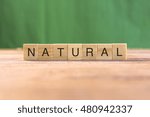 the word of NATURAL on wood tiles concept