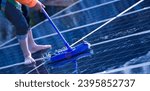 Small photo of Photoelectric technicians washing and cleaning the upper surface of solar rooftop of the building to increase power efficiency of solar panel system, soft focus, new edited, cropped shot.