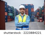 Small photo of Engineer worker standing confident on site containers yard terminal background, Worker employee standing confident container logistic background.