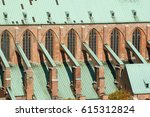 Small photo of Southern side of Lubeck's ancient St. Mary's Church, red brick gothic, arched windows, flying buttress, verdigris covered roofs; World Cultural Heritage Site Hanseatic City of Lubeck, 14/10/2013