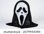 Paris, France - 11 22 2021: Packshot of Masked woman. A black and white scream mask