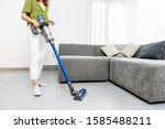 Woman Cleaning Floor With...