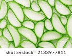 Small photo of Fresh aloe vera slice soak in aloe vera gel texture for background , top view , flat lay.