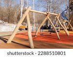 Children's playground in the park. Swings and carousels for children outdoors..