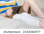 broken leg in cast of... | Shutterstock . vector #2132360577