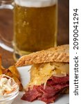 Small photo of reuben sandwich on a plate with fries