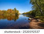 Reflection of a colorful forest in the Wisconsin River, horizontal