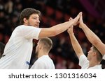 Small photo of NOVEMBER 29, 2018 - ZAPORIZHIA, UKRAINE: Captain Viacheslav Kravtsov close-up portrait giving a high five. FIBA World Cup 2019 Qualifiers Ukraine-Slovenia