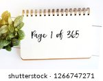 Page 1 of 365, new year positive quotation on notebook paper background
