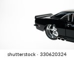 Modified black Chevrolet Camaro models tire rim detail. Isolated on white.