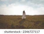free woman running happy in a field